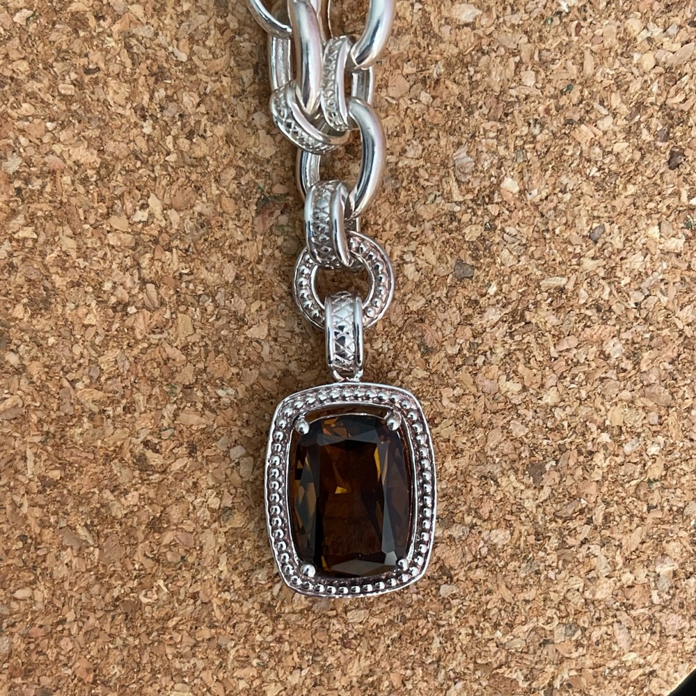 Topaz enhancer on silver chain